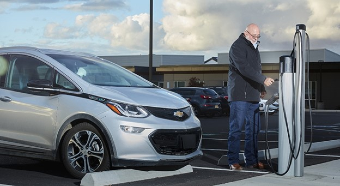 Image of man with electric vehicle