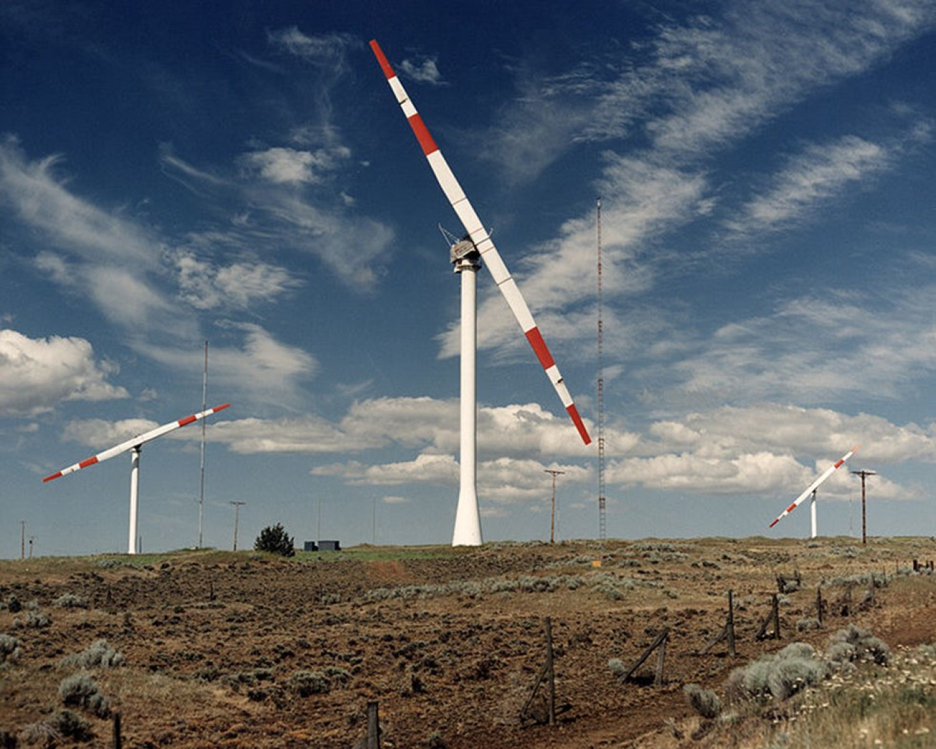 An early wind turbine prototype in an agricultural field.