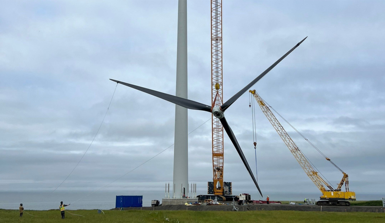 The blades of a wind turbine being lifted into place in Stebbins, Alaska. 