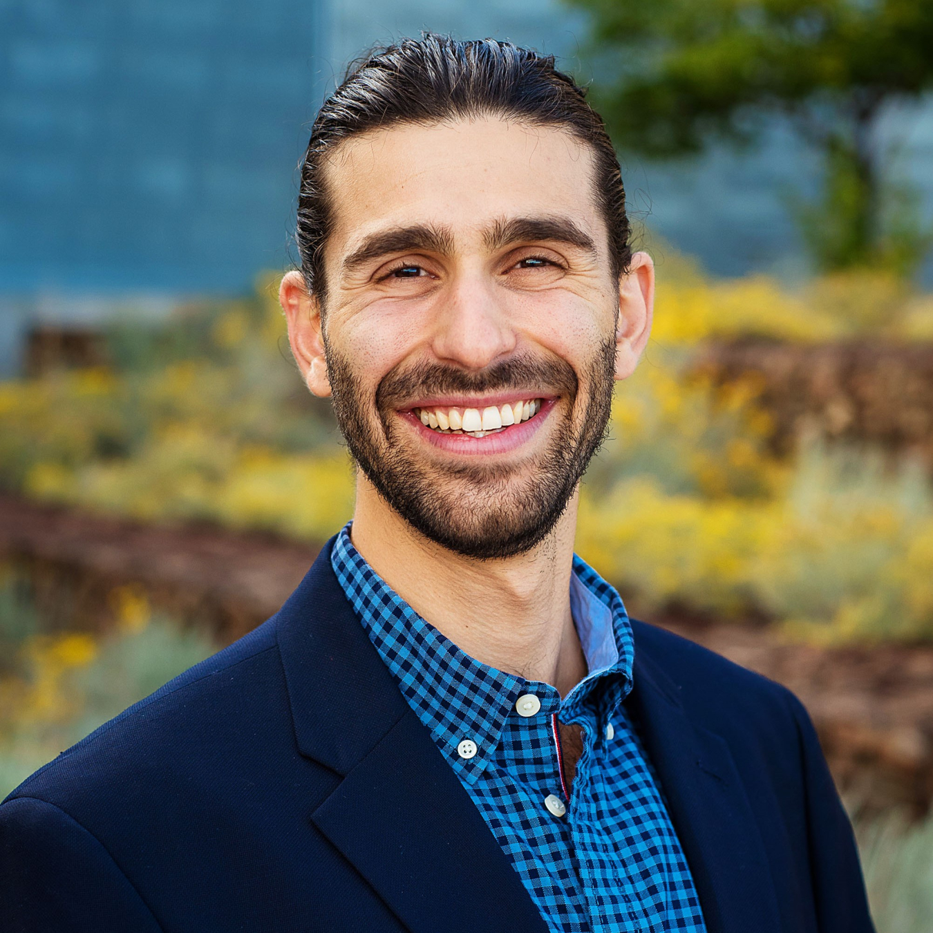 A man poses and smiles for the camera.