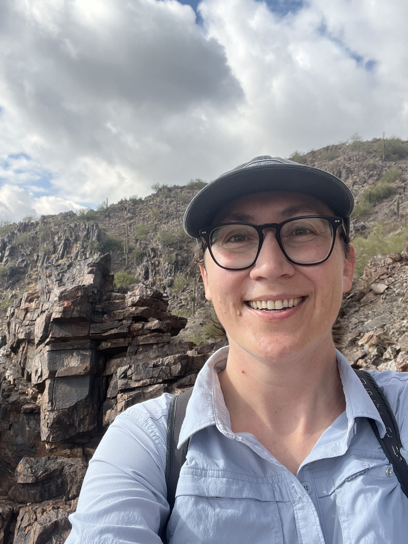 A person hiking on a rocky mountain trail.