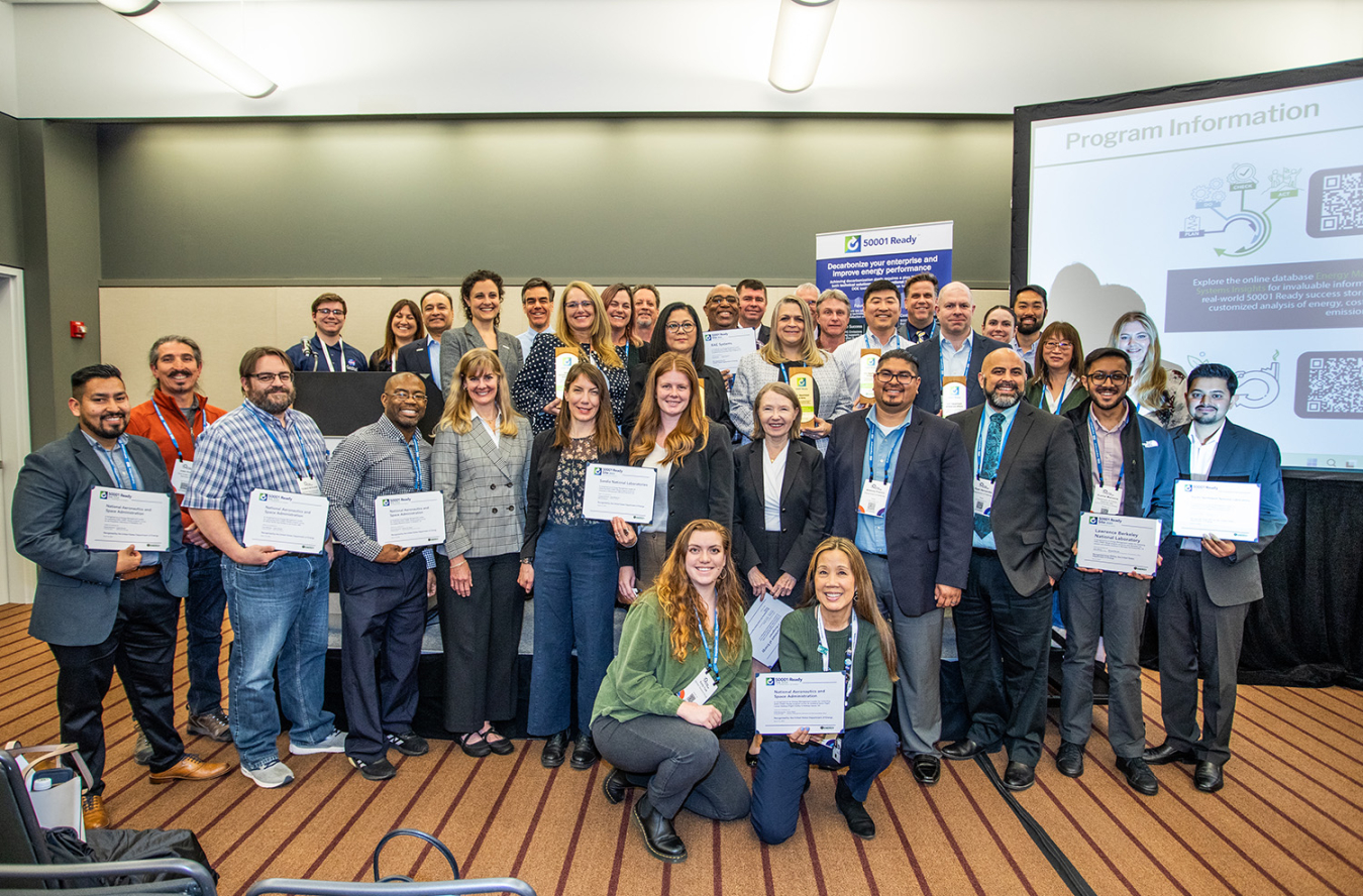 A group of federal employees pose for a picture.