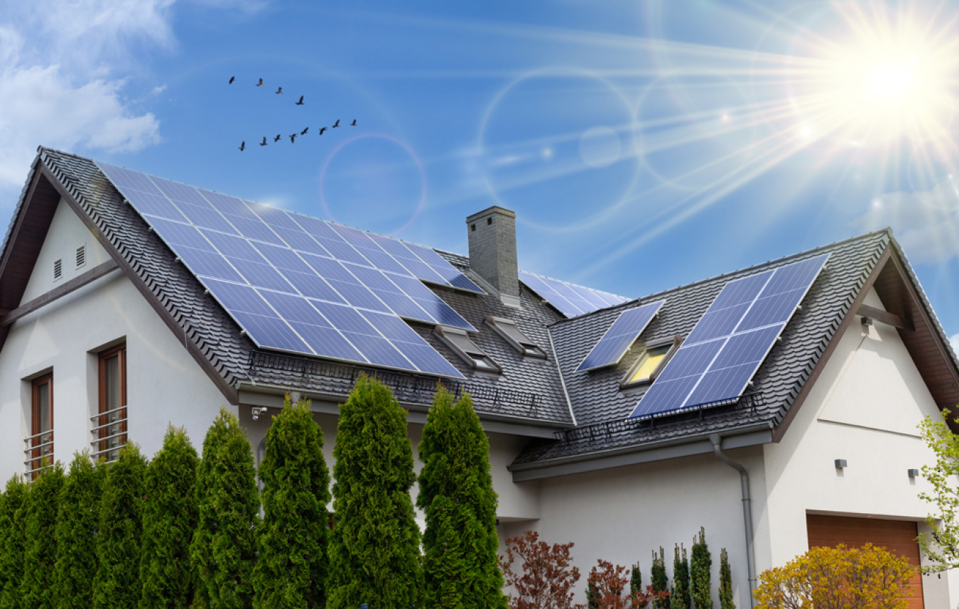 A house with solar panels being installed on the roof