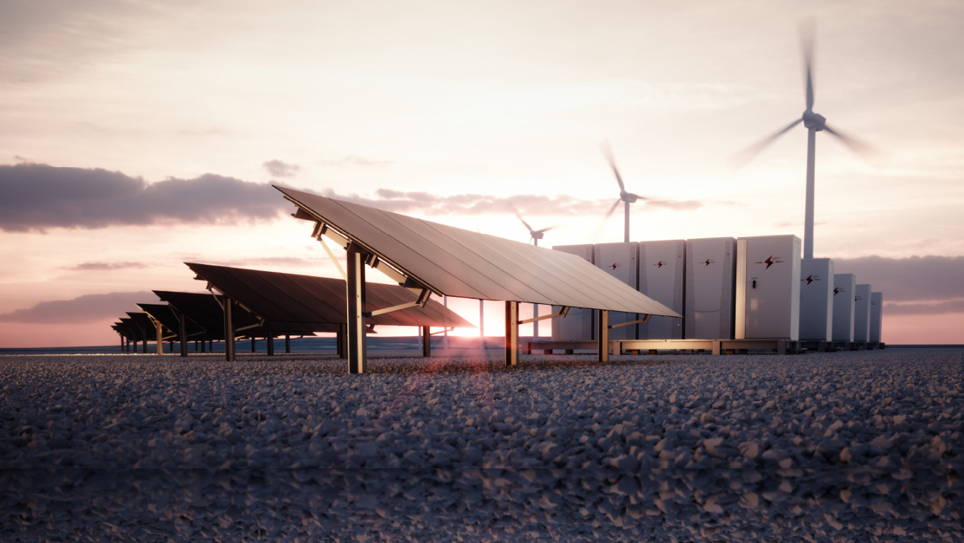 solar panels with wind turbines and energy storage containers in the background at twilight.