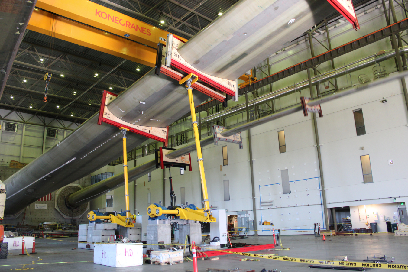 Long turbine blade in a warehouse. 