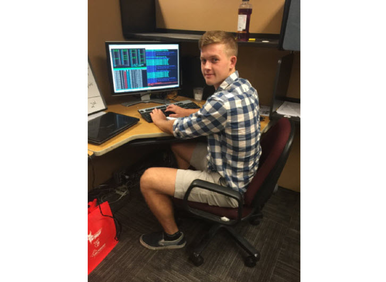 Bryan Moore sitting at a computer desk.