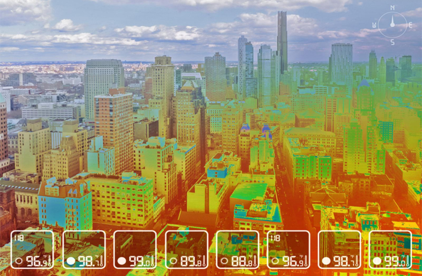 A photo of part of New York City with a heat map overlaid on top, with red showing the warmest areas.