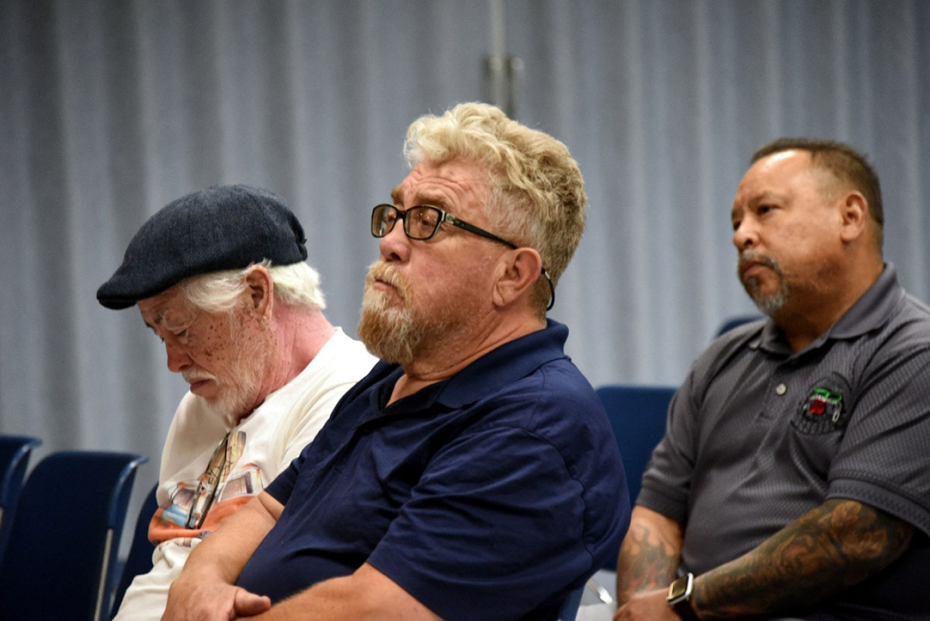 More former workers in attendance listen to presentations.