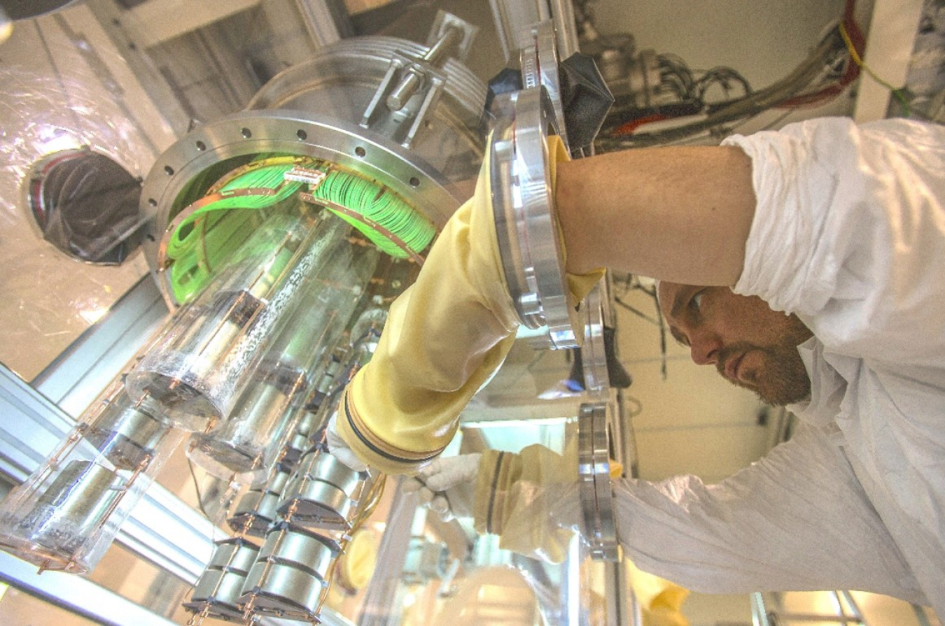 Physicist assembling detectors 1.4 km under the mountains in Italy to search for a rare nuclear decay that if observed, could explain why we are made of matter and not anti-matter. 