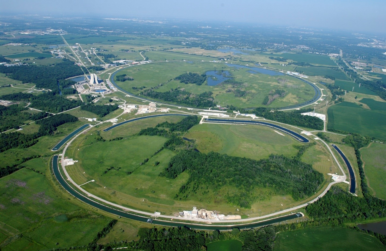 An aerial view of a road and a river.