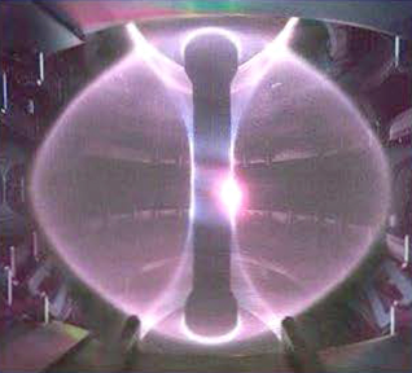 Image of the inside of a magnetic confinement experiment during plasma discharge.