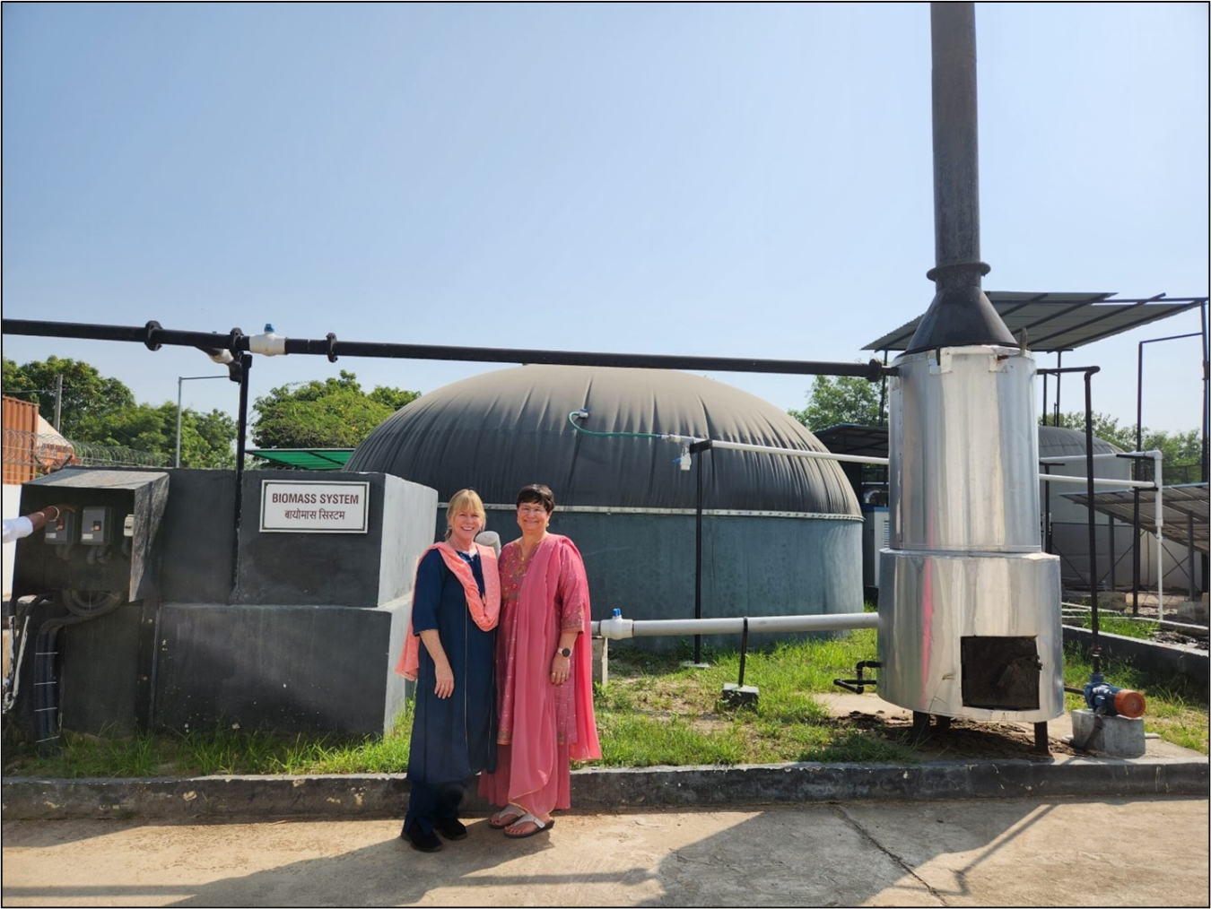 Merrill Smith (left) and Noel Schulz at the Harnoo Village Biomass System