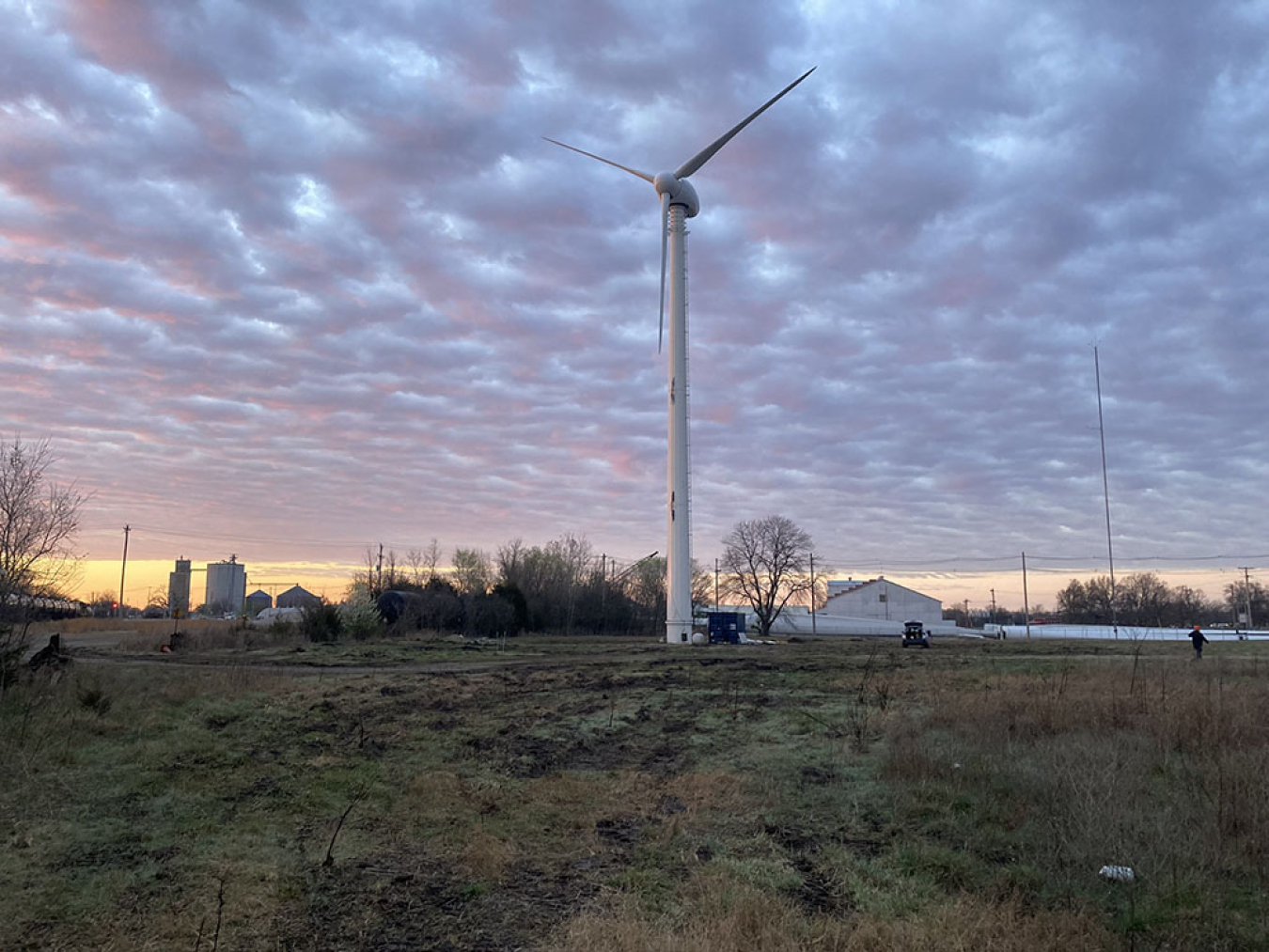 Distributed wind turbine in a grassy field