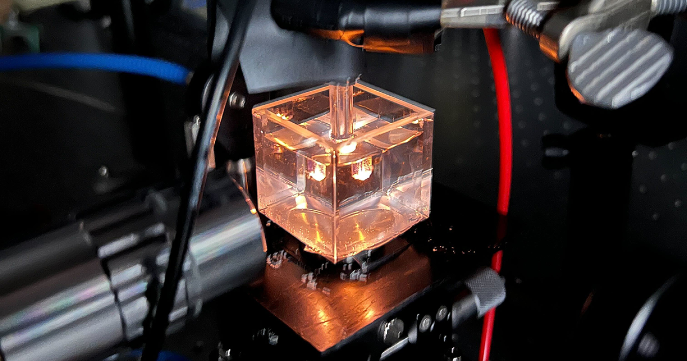 Glowing cube demonstrating plasma bubble spectroscopy developed at NC State University.