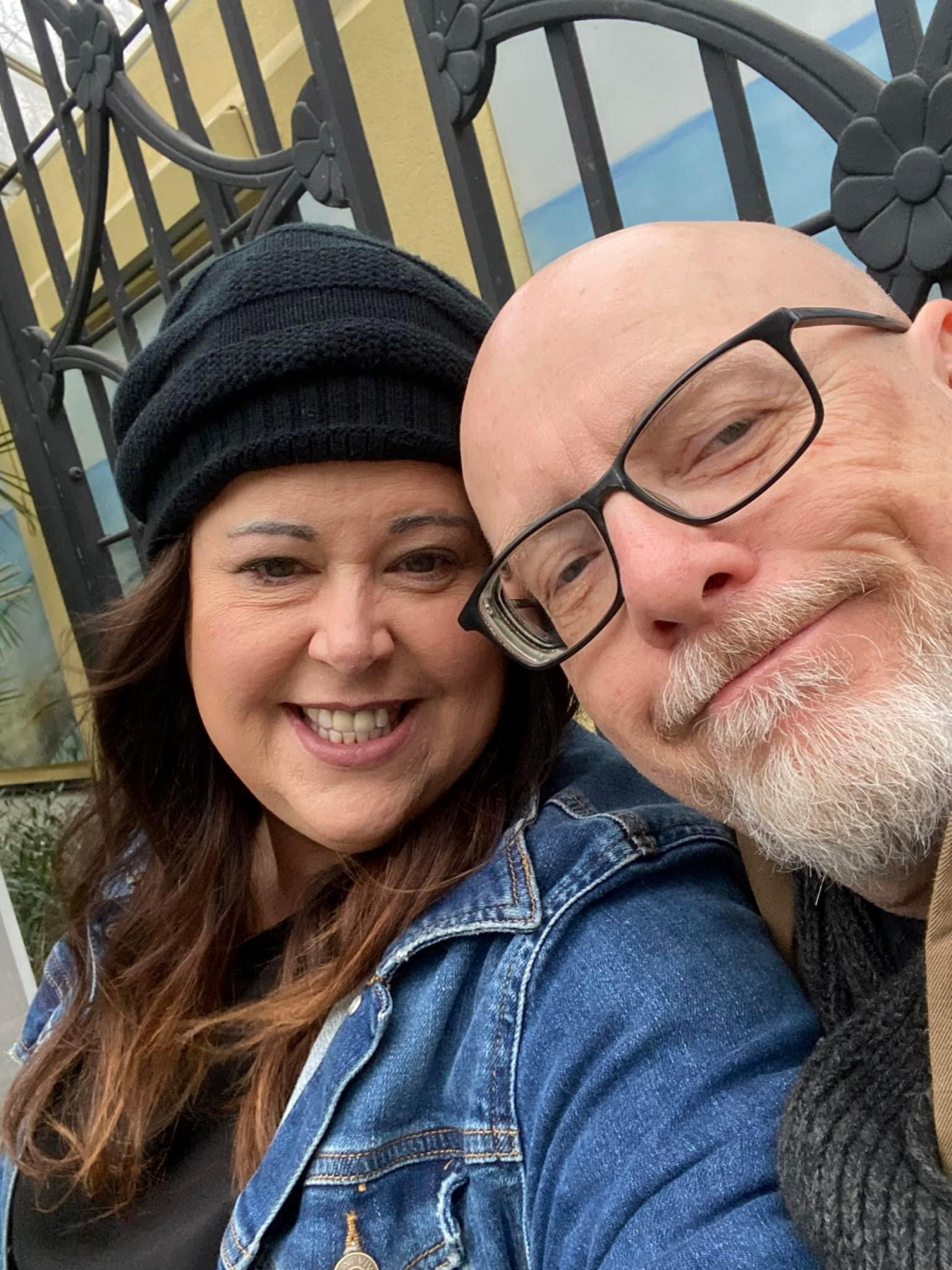 Selfie of Gary and his wife sitting outside. 