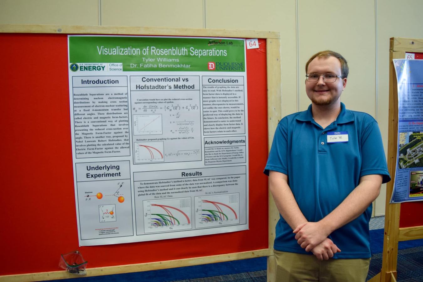 Tyler Williams standing beside his poster at research symposium