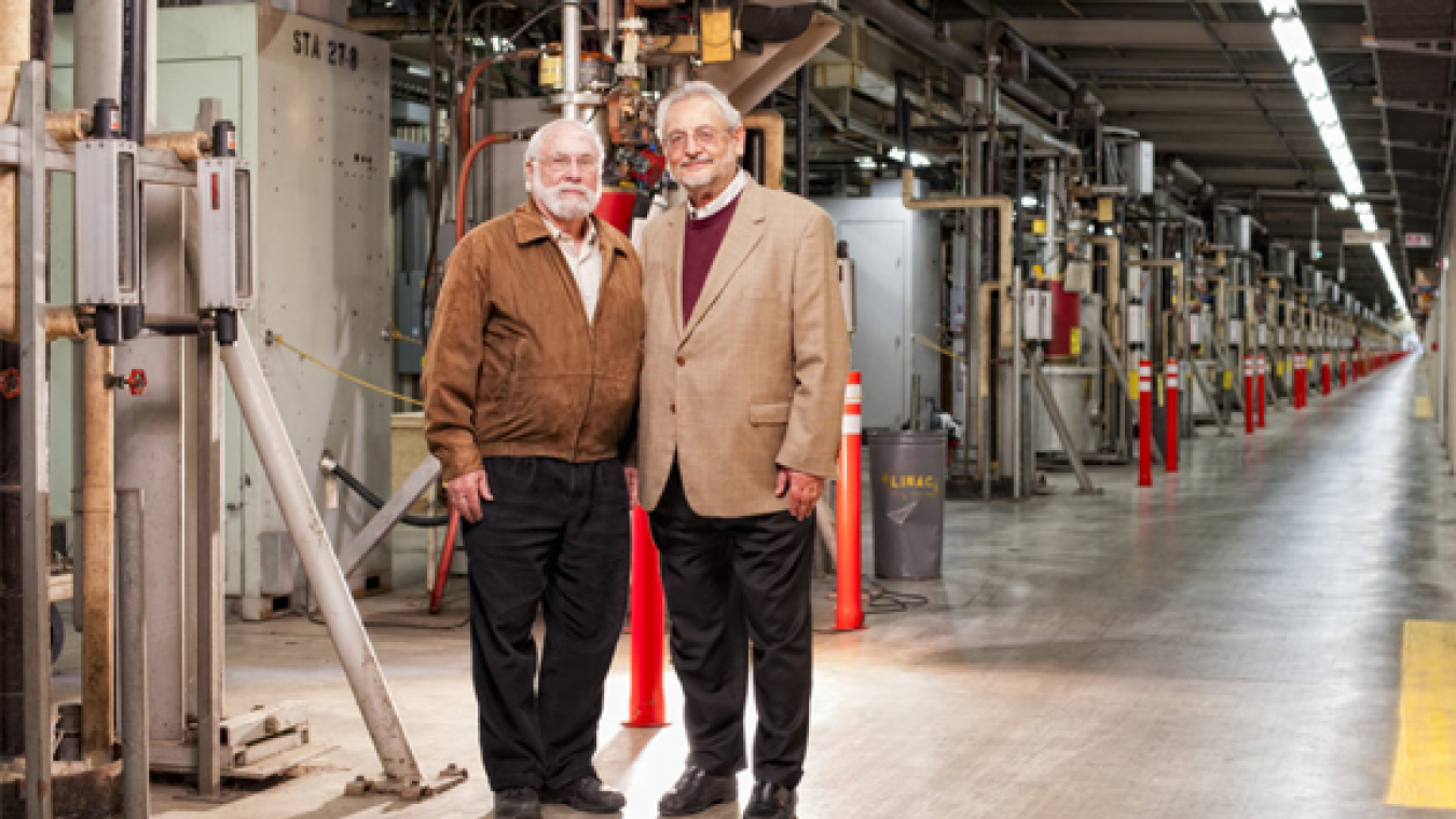 Claudio Pellegrini (right) and SLAC scientist Herman Winick in the klystron gallery of SLAC's linear accelerator. Pellegrini and Winick were instrumental in making the idea for LCLS a reality.