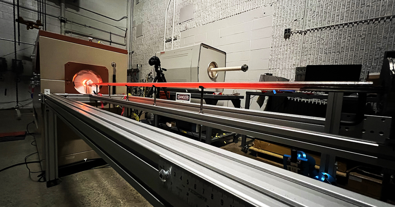 An eVinci microreactor heat pipe glows bright red in a test facility.