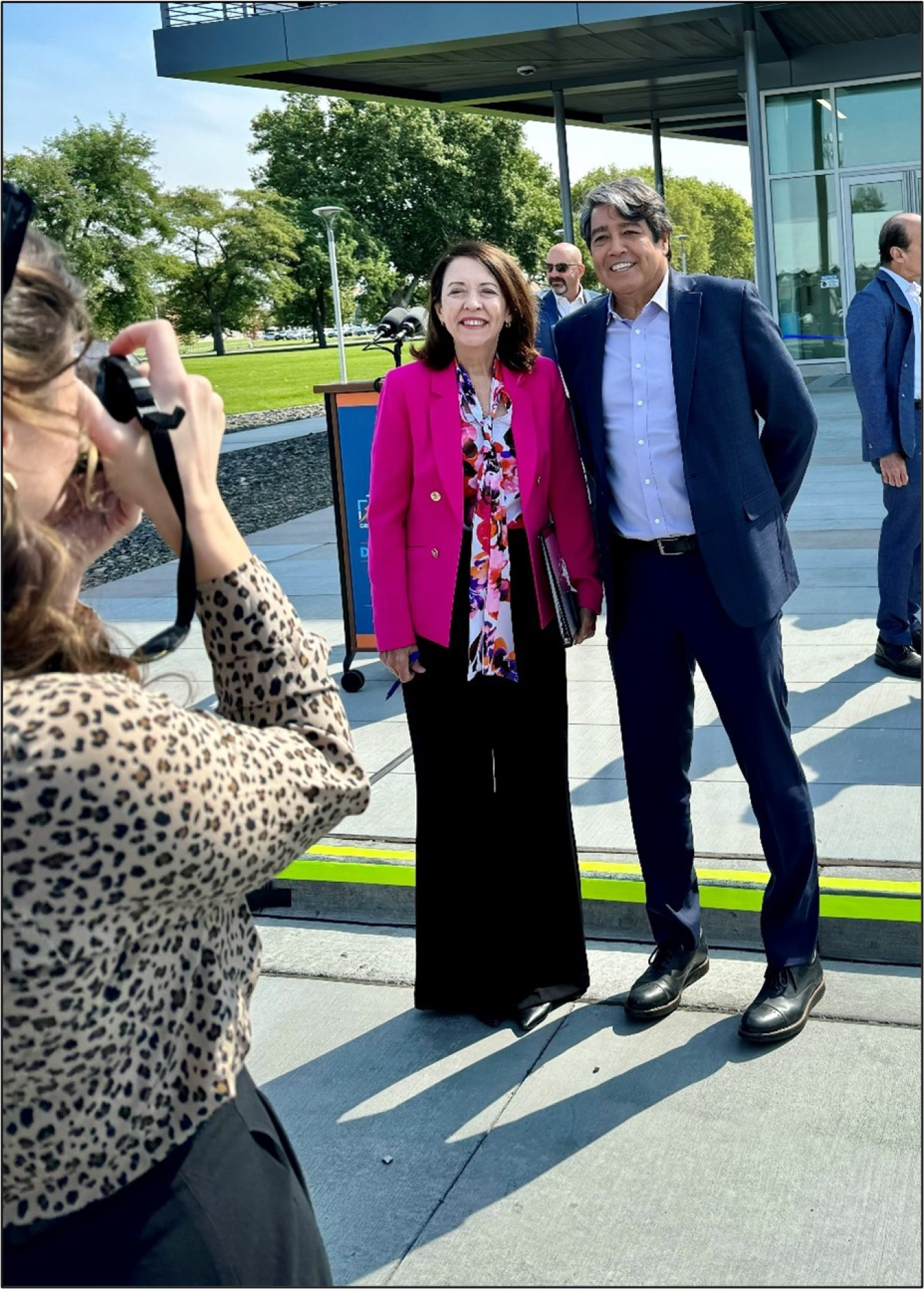 U.S. Senator Maria Cantwell and Gene Rodrigues, Assistant Secretary for Electricity, pose for a media photographer outside the GSL during opening celebrations