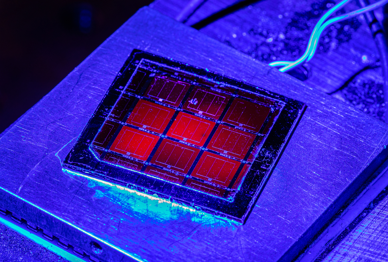 Solar cells on a slide illuminated by blue light 