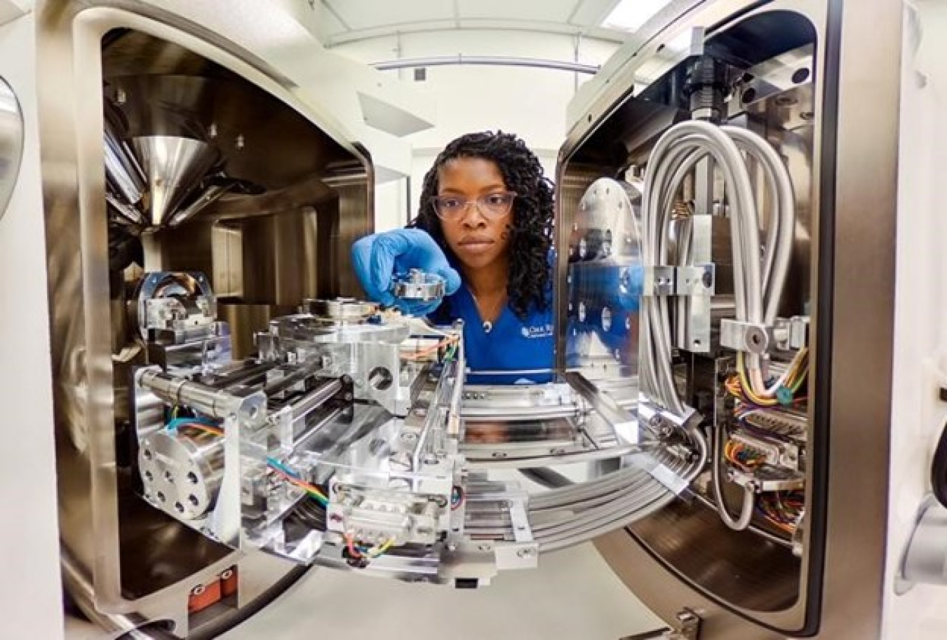 A scientist observing her work.