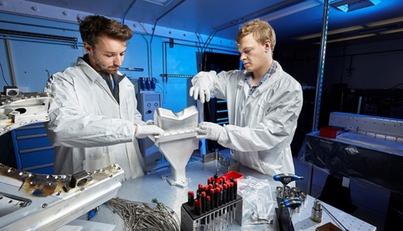 Scientists working in the lab with vials.