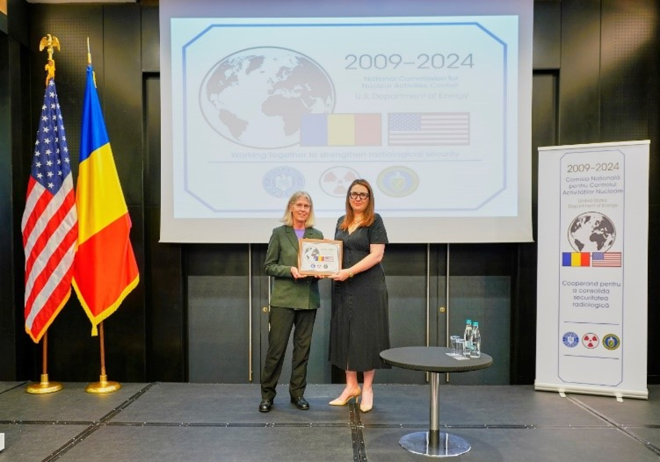 NNSA Administrator and Romanian State Secretary for Strategic Affairs Ana Tinca with a celebratory plaque