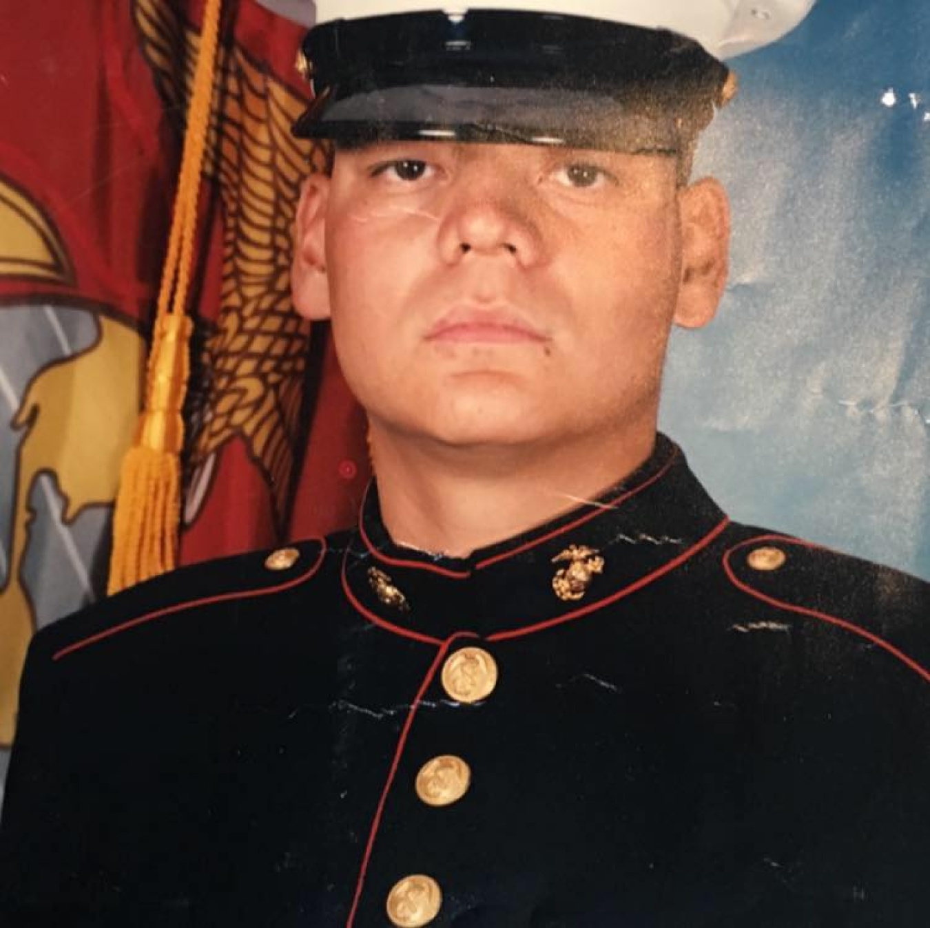 A headshot picture of a person in a military uniform. 