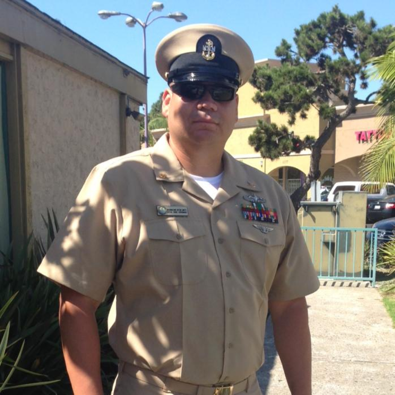 Photo of a person in a military uniform looking at the camera. 