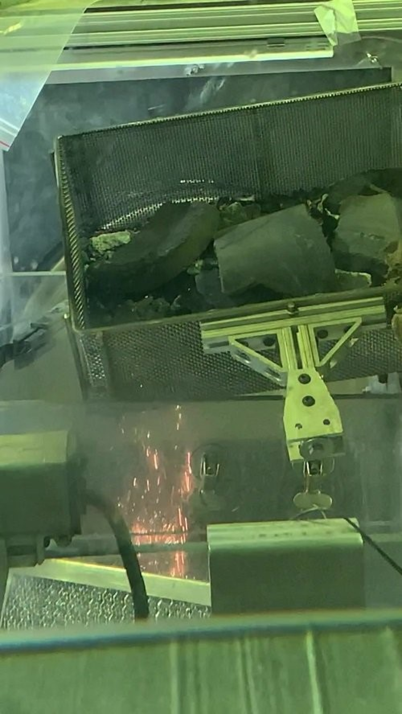 Crews treat a potentially hazardous metal inside a hot cell at the Idaho Nuclear Technology and Engineering Center to render it safe for offsite disposal