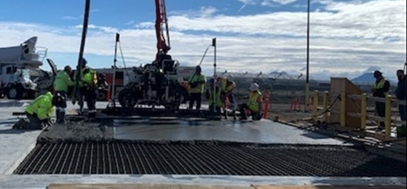 Construction workers with U.S. Department of Energy Office of Environmental Management contractor Idaho Environmental Coalition employ advanced concrete equipment and processes to construct a new storage facility at the Idaho National Laboratory Site’s Integrated Waste Treatment Unit. These advancements have resulted in more protections for worker safety.