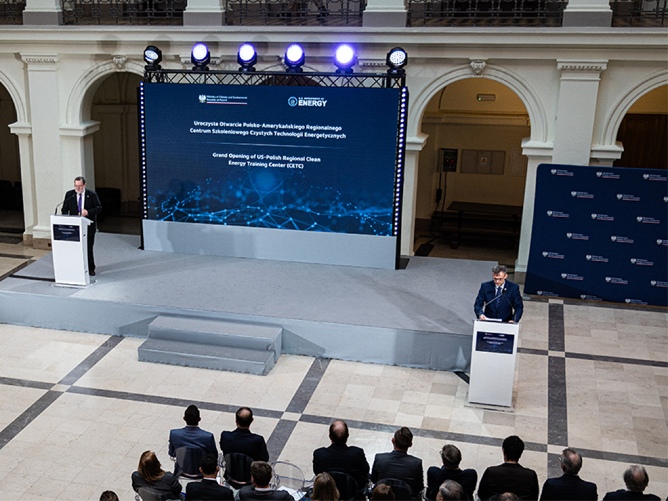 delegates from Poland and the United States speaking at an event 