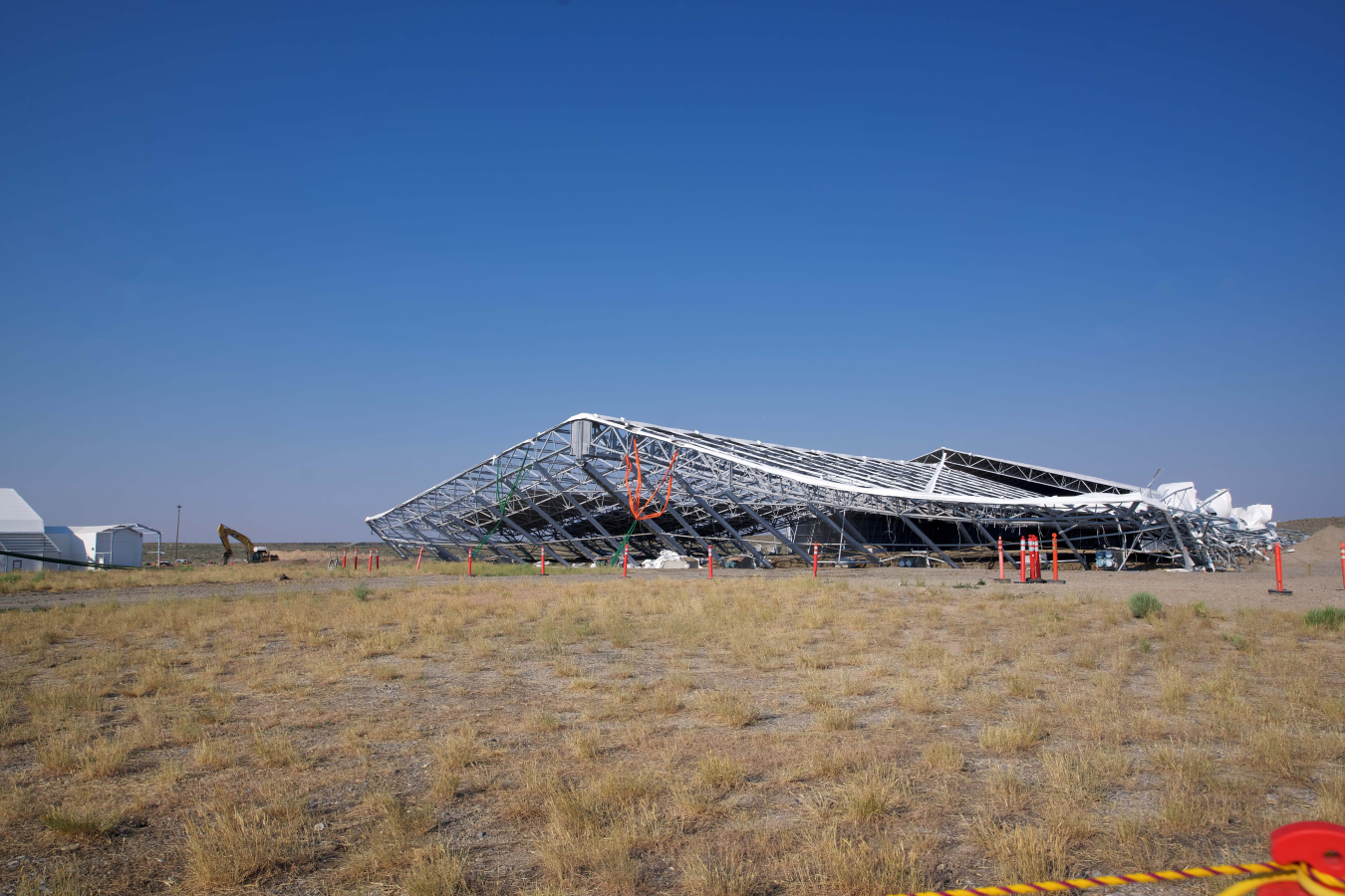 Structure leaning over as it is pulled down