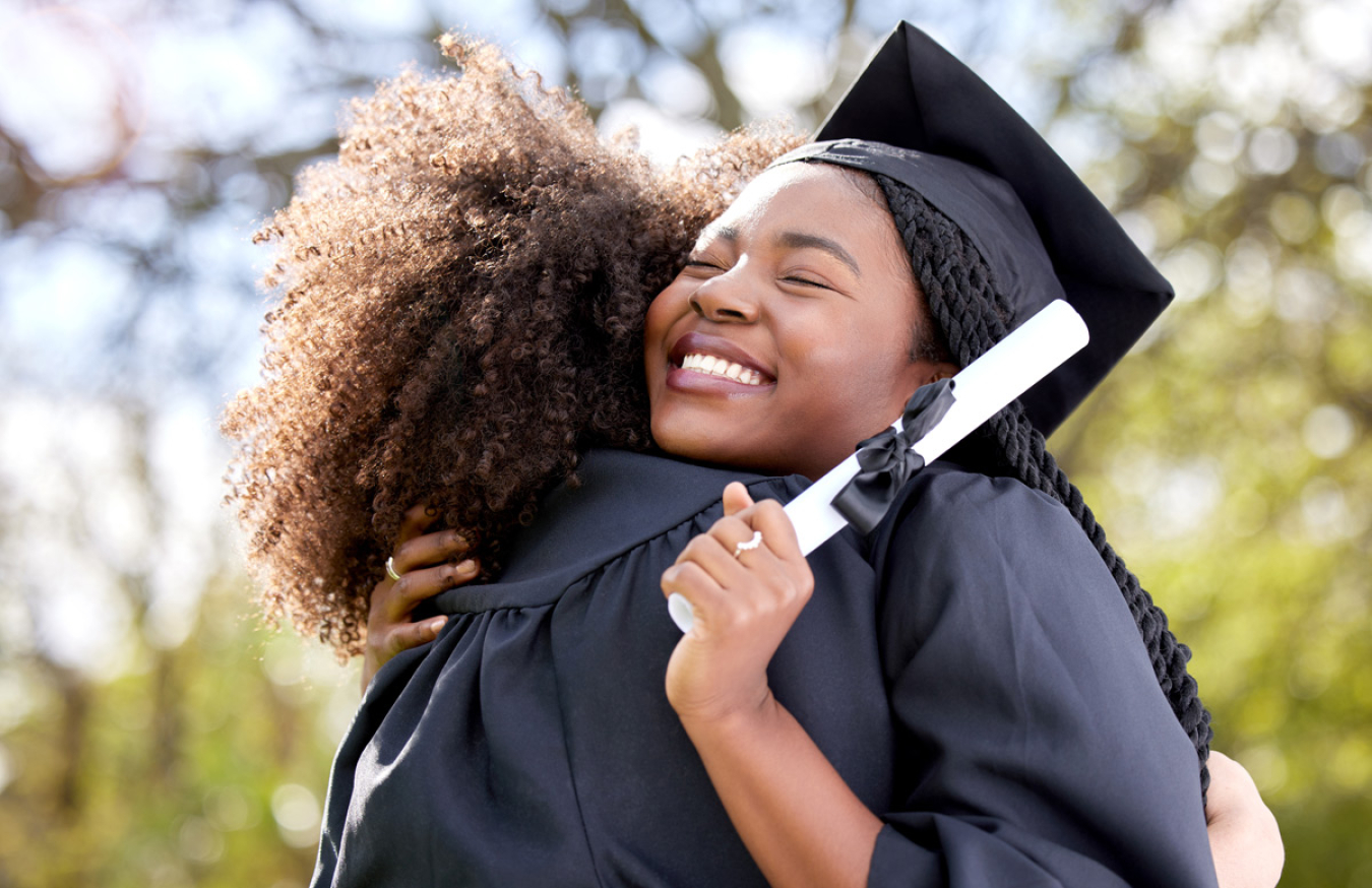 Graduate hugging someone