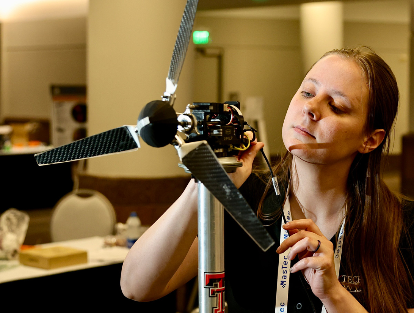 Person working on a wind turbine model