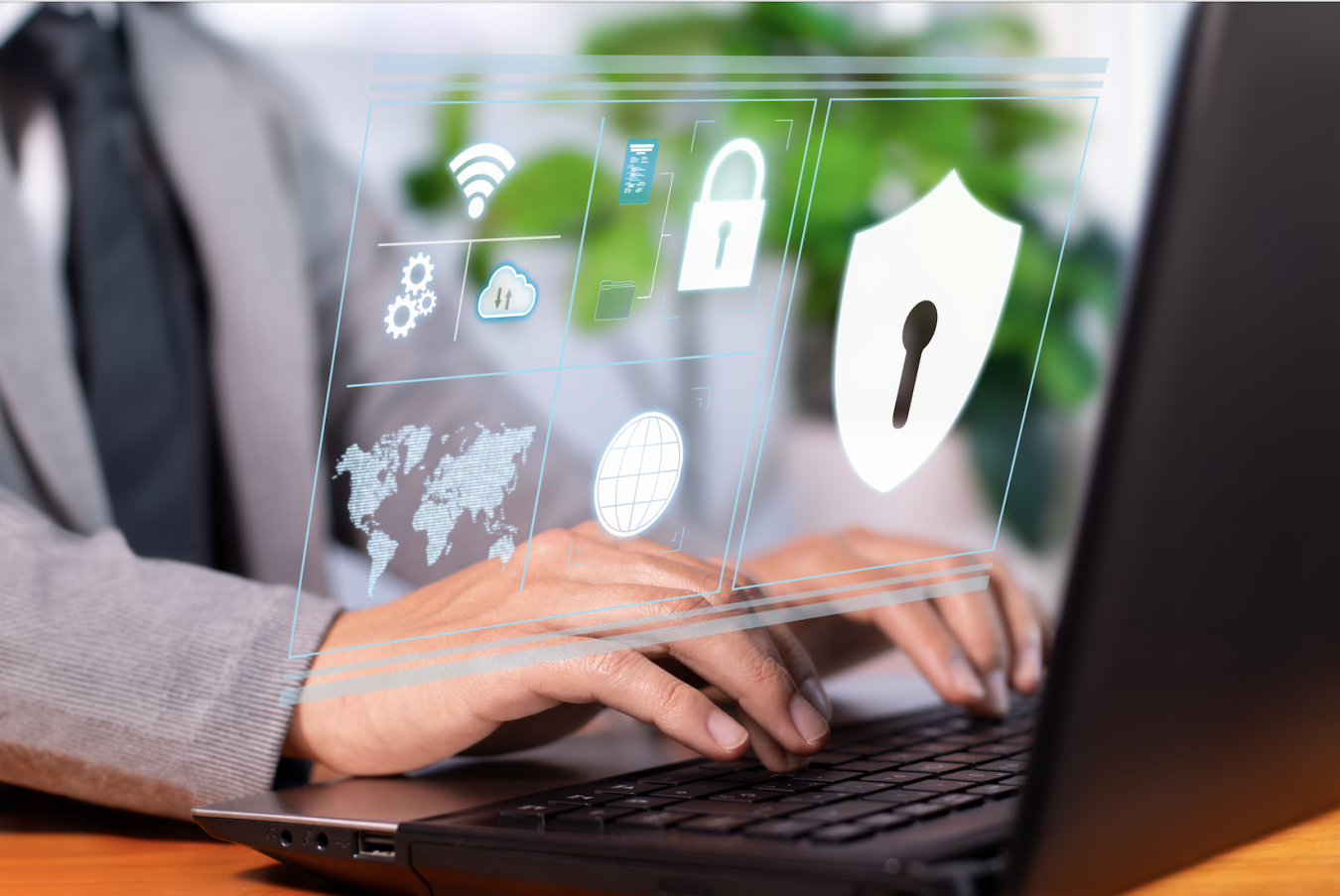 A security administrator works on a laptop