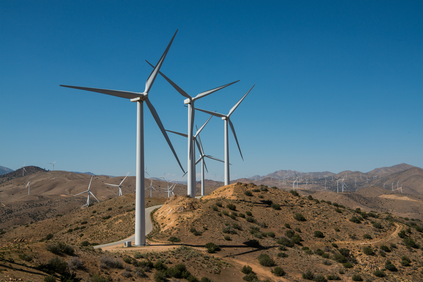 wind turbines against blue sky