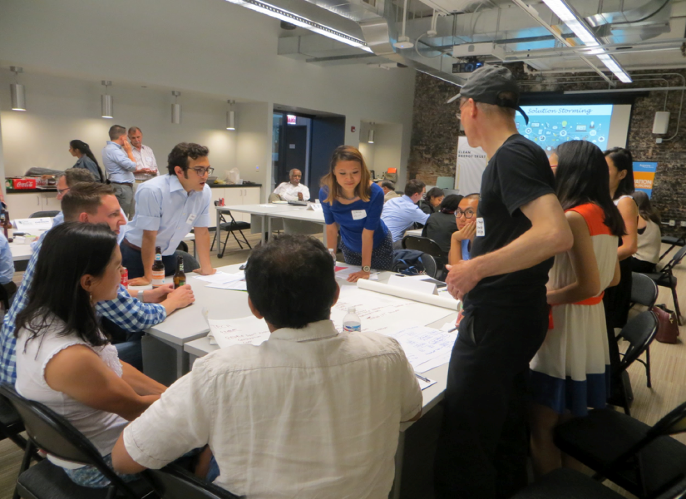 A meeting room of people interacting.