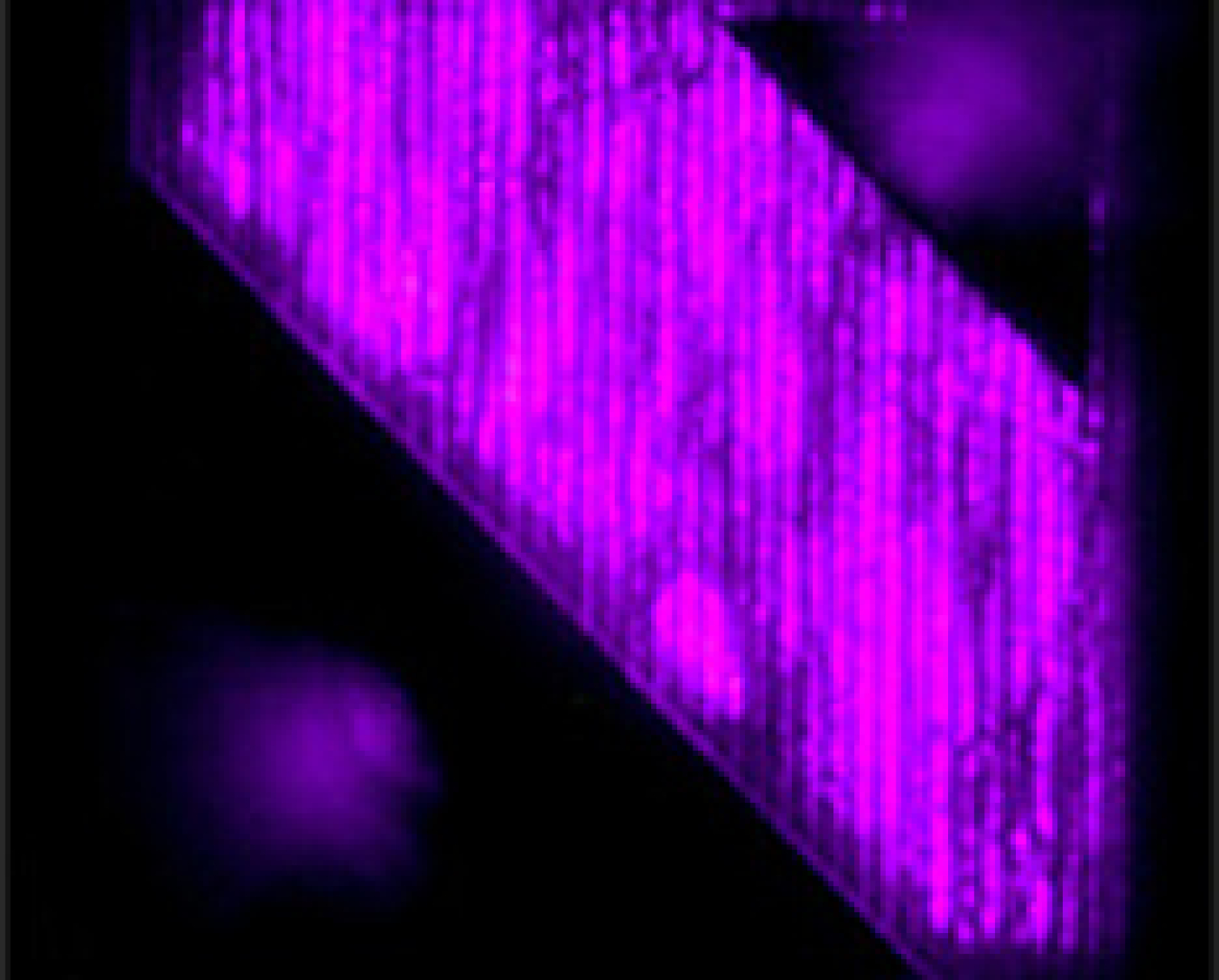 An electroluminescence image of an LED fabricated using the cantilever epitaxy process shows uniform LED intensity over multiple regions.