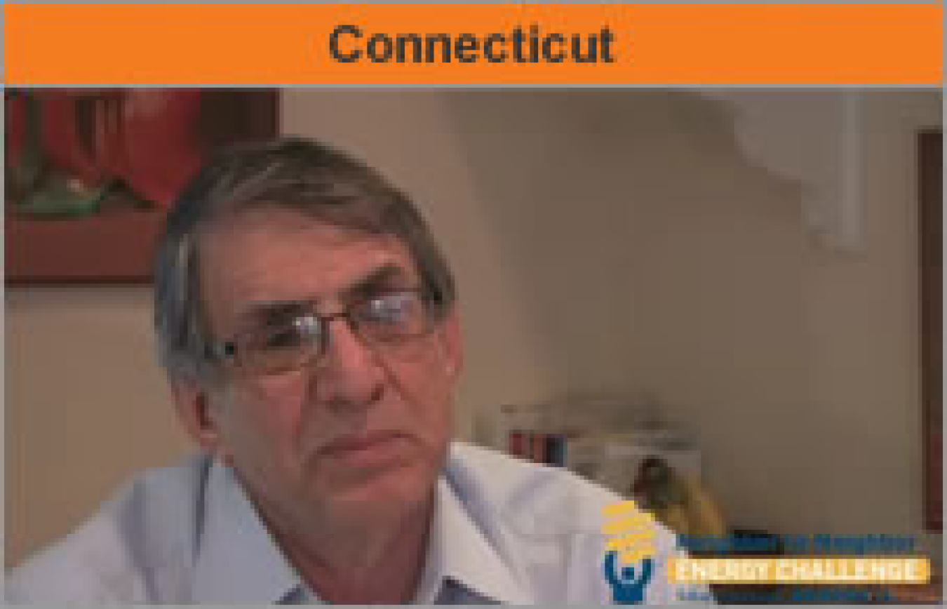 Head-and-shoulders shot of a man facing the camera, with the word "Connecticut."