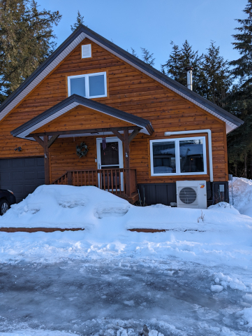 A house surrounded by snow.