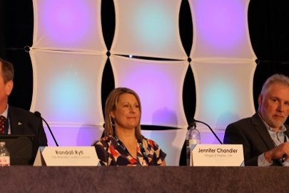 Members of the panel titled “Maximizing Reuse Opportunities at EM Sites” included, from left, Randall Ryti, chair of the Los Alamos County Council; Jennifer Chandler, administrator of the Village of Piketon, Ohio; and Ken Rueter, president and CEO of UCOR.